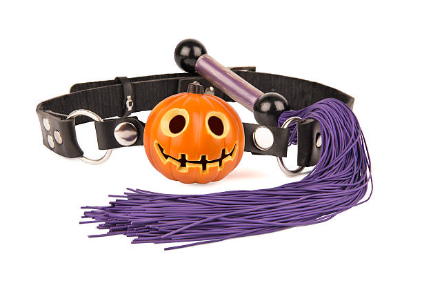 A Halloween-themed collar featuring a pumpkin design and a vibrant purple rope, perfect for BDSM